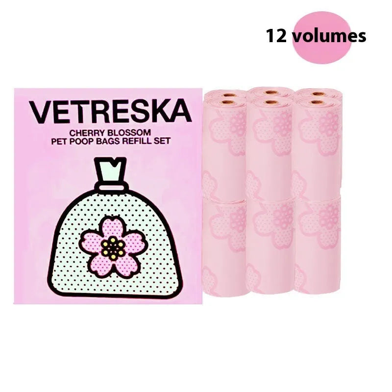 Portable dog waste bag dispenser capsule with scented inner bags in strawberry, orange, and cherry blossom options