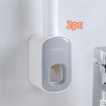 Wall mounted automatic toothpaste holder dispenser set with toothbrush slots and upside-down mouthwash cup in black plastic