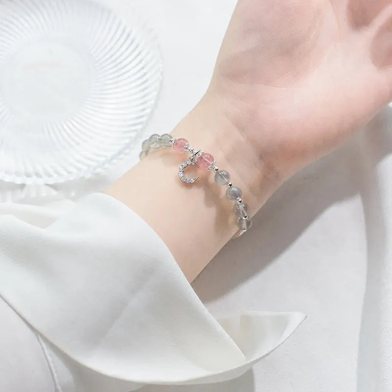 Handmade adjustable moonstone bracelet with crescent moon charm showing 6mm beads and extension chain