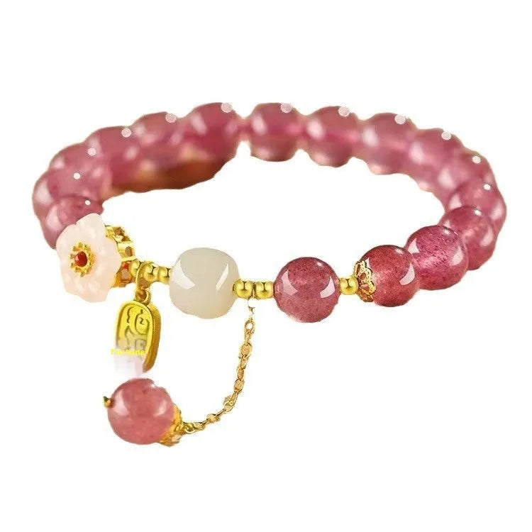 Handmade strawberry quartz crystal bracelet for women showing natural bead designs