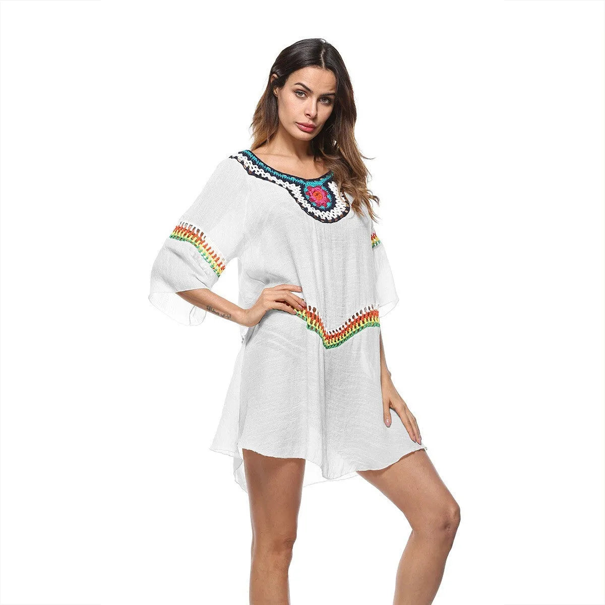 Crocheted ethnic-style white acrylic beach cover-up for women on a mannequin