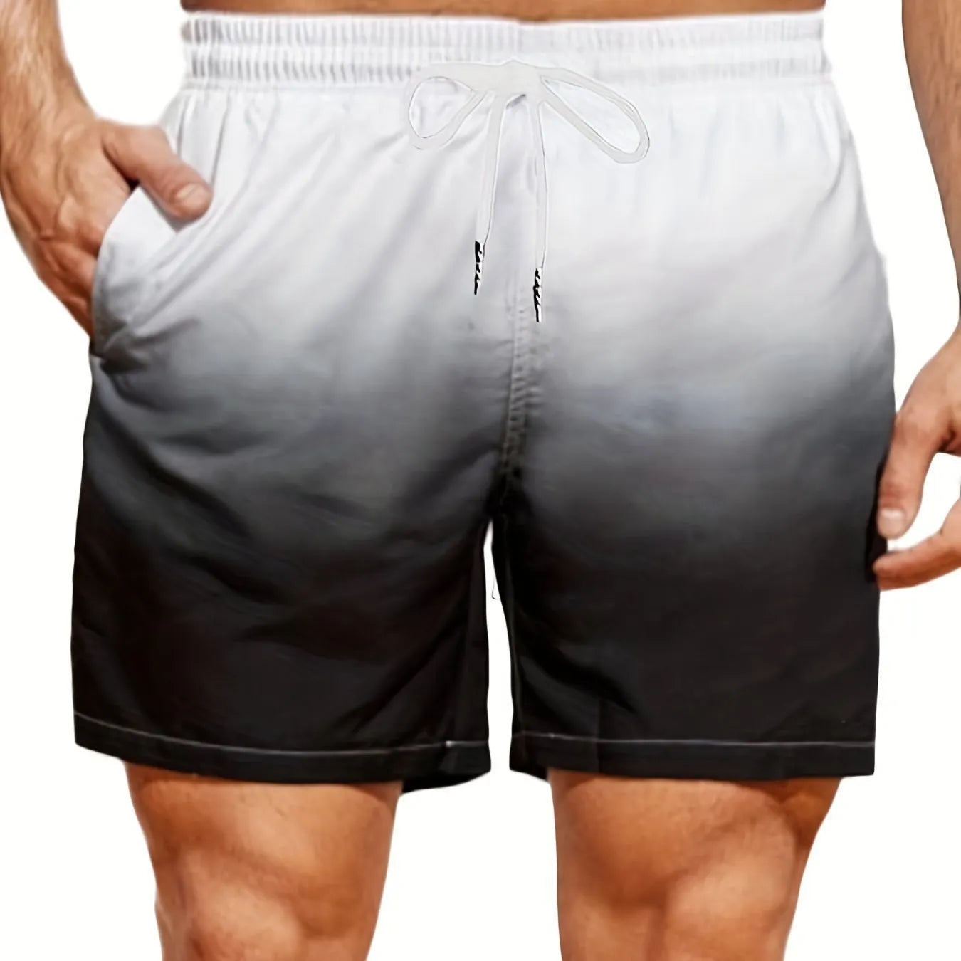 Men's grey and blue gradient printed mesh sport shorts on a white background.