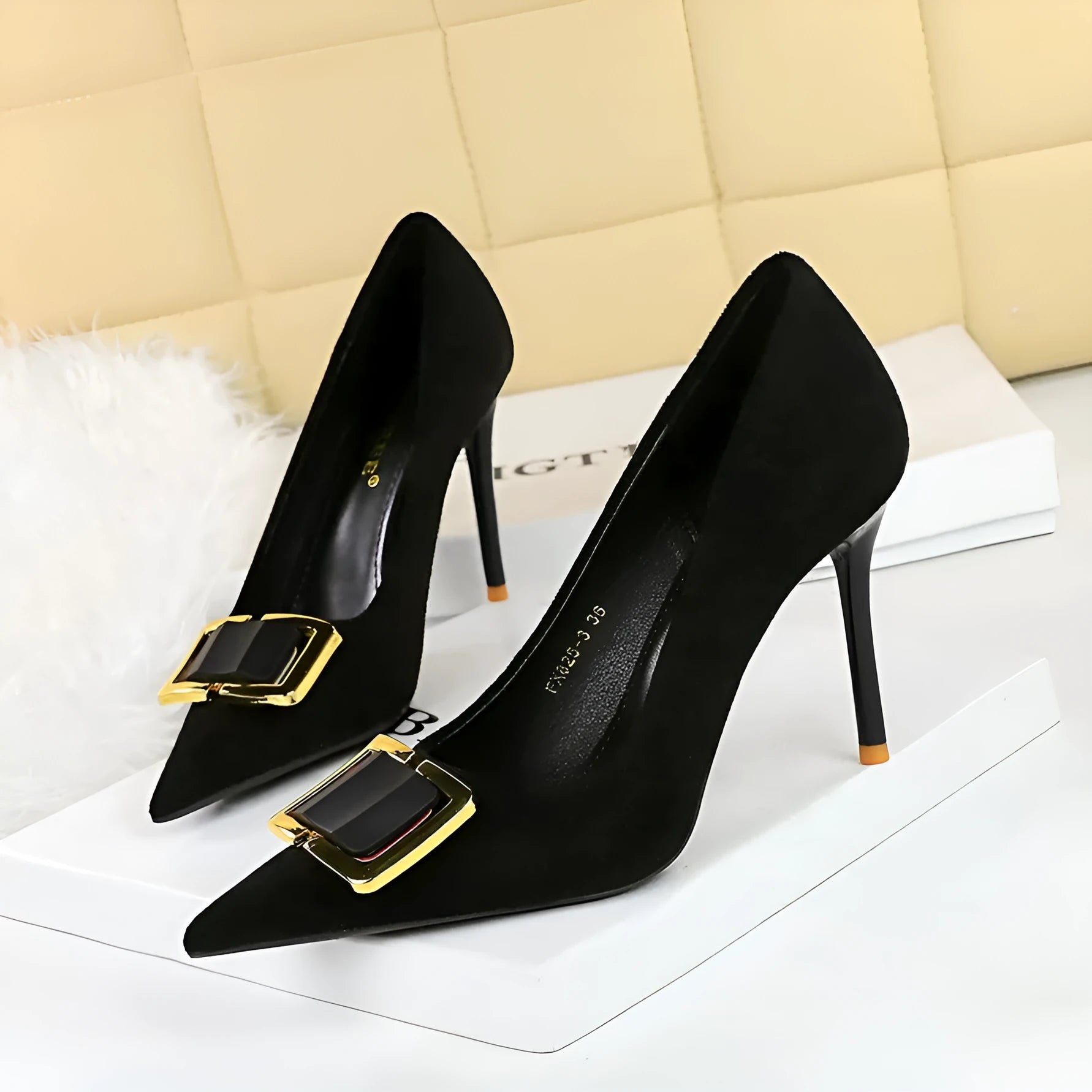 Black suede women's stiletto high heels with a pointed toe and 9cm heel on a white background.