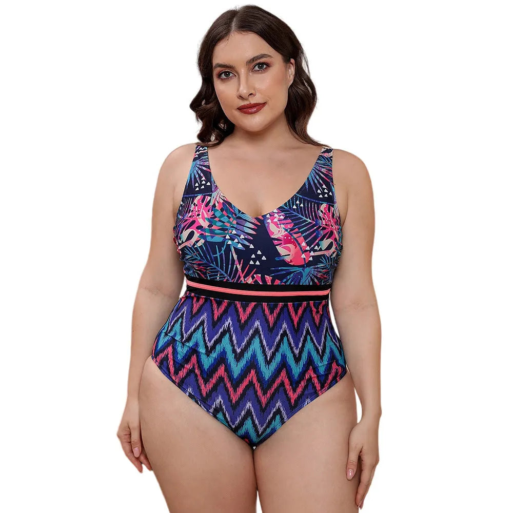 Women's blue printed one-piece swimsuit with spaghetti straps and a striped vest style.