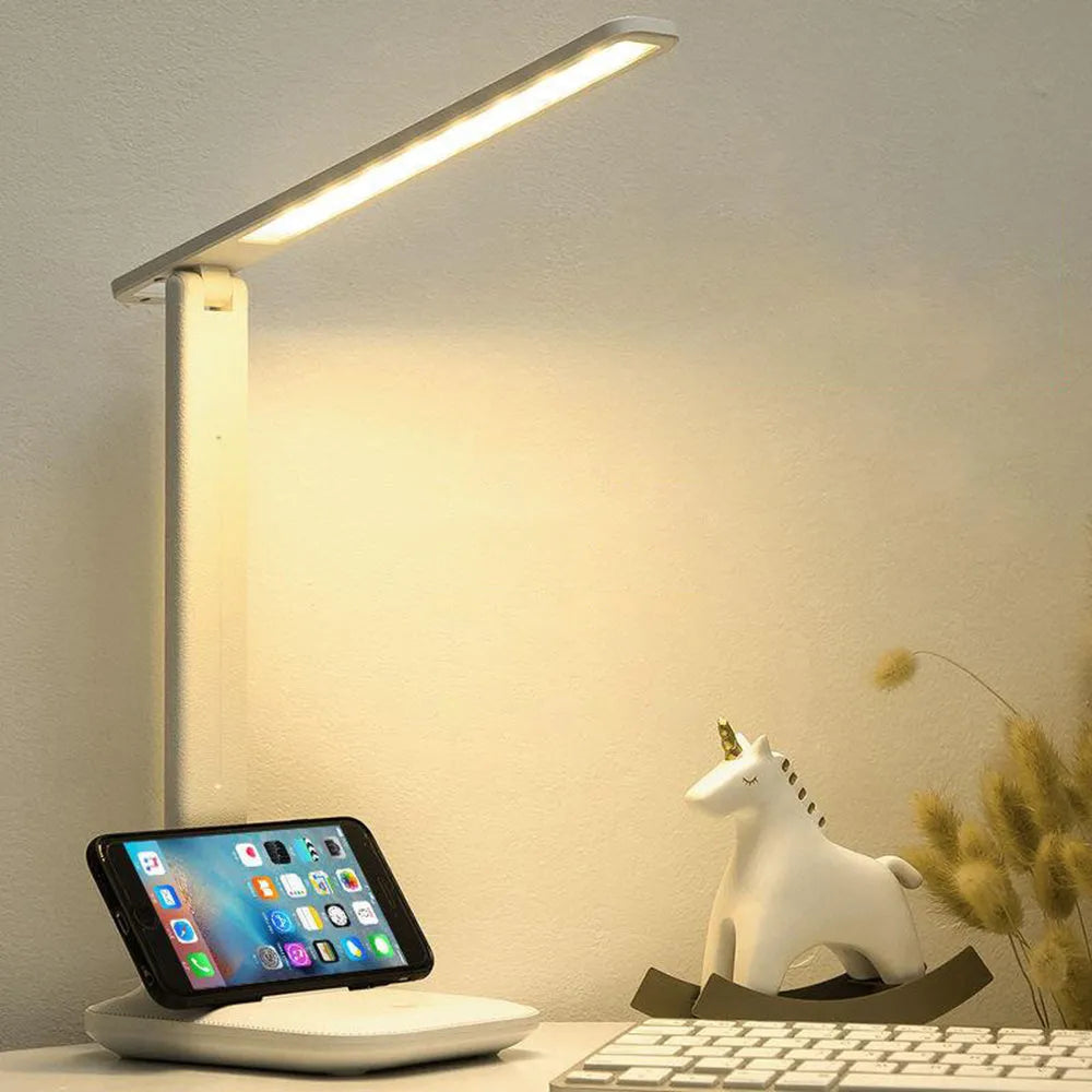 White plastic bedside lamp with touch dimming controls for children's bedrooms