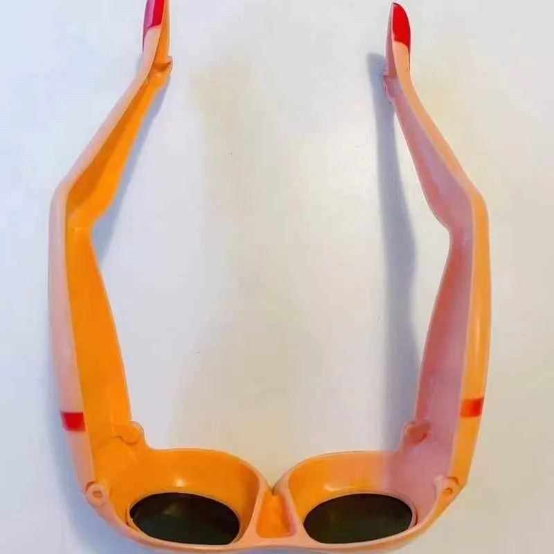 Orange plastic sunglasses with a novel leg and hip personality design on the frame.