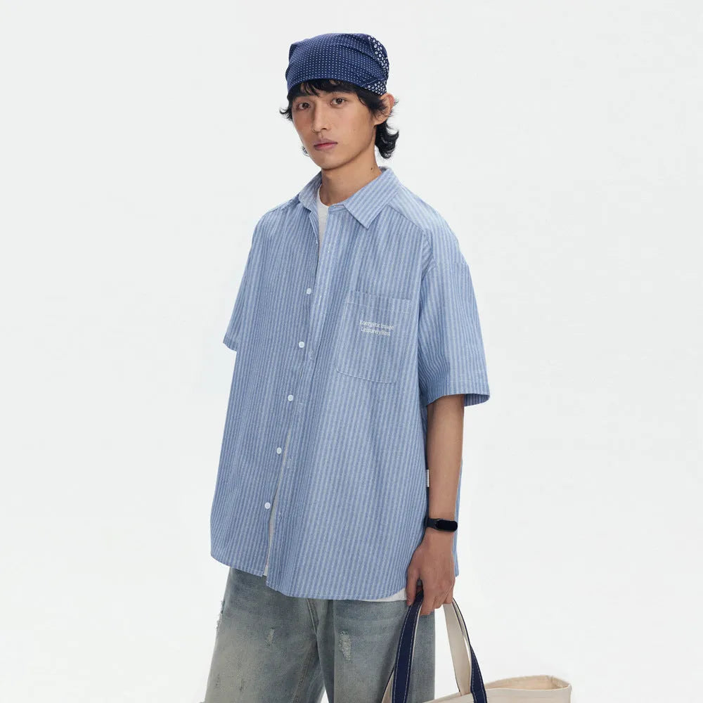 Blue striped loose fit overalls shirt with short sleeves on hanger