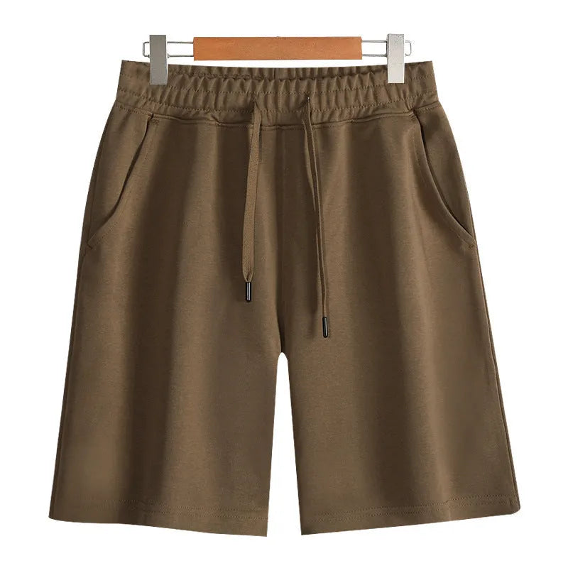 Cotton micro-elastic straight leg summer shorts for men and women on a neutral background.