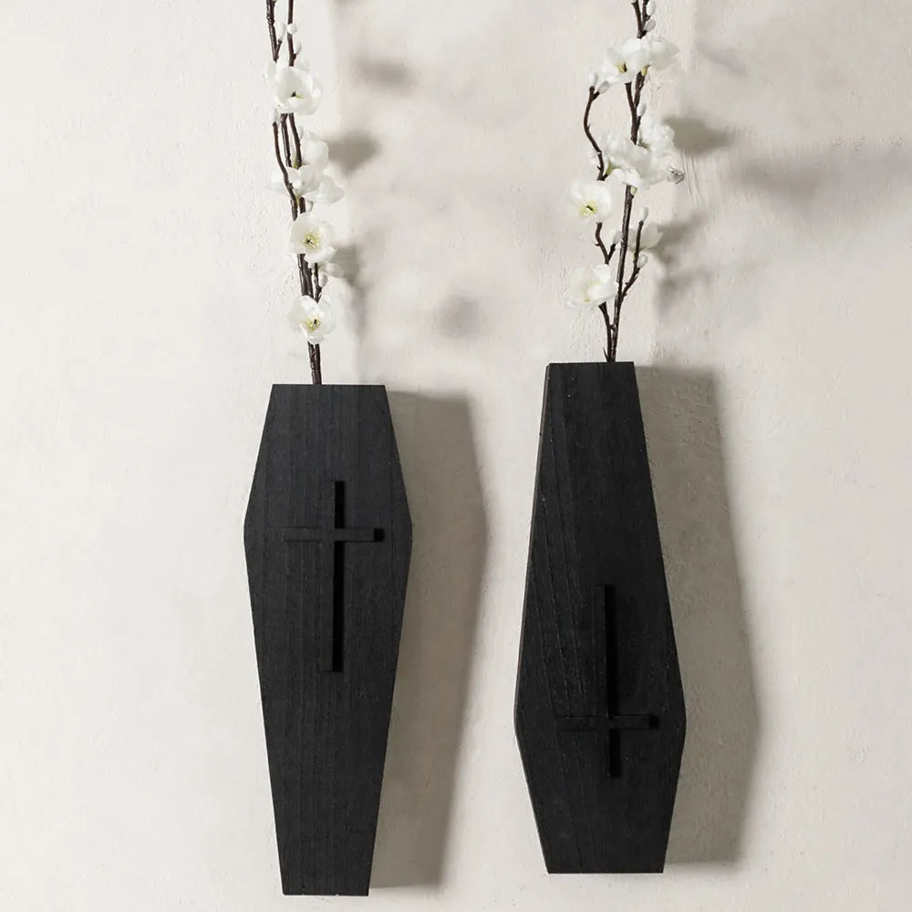 Black cross-shaped wooden wall vase shelf for decorative display measuring 27cm wide by 9cm tall
