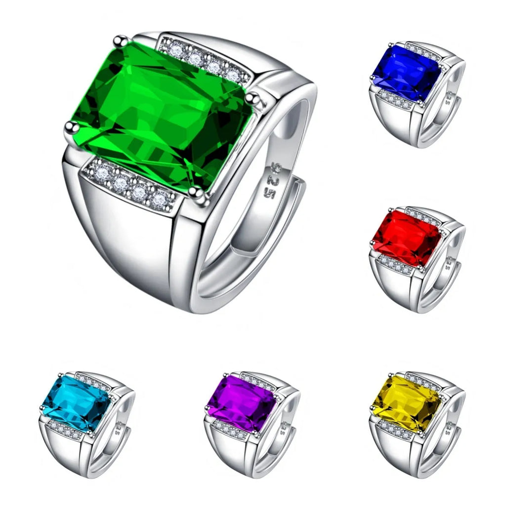 Adjustable open geometric ring with a coloured rhinestone stone on a copper band with plated finish.