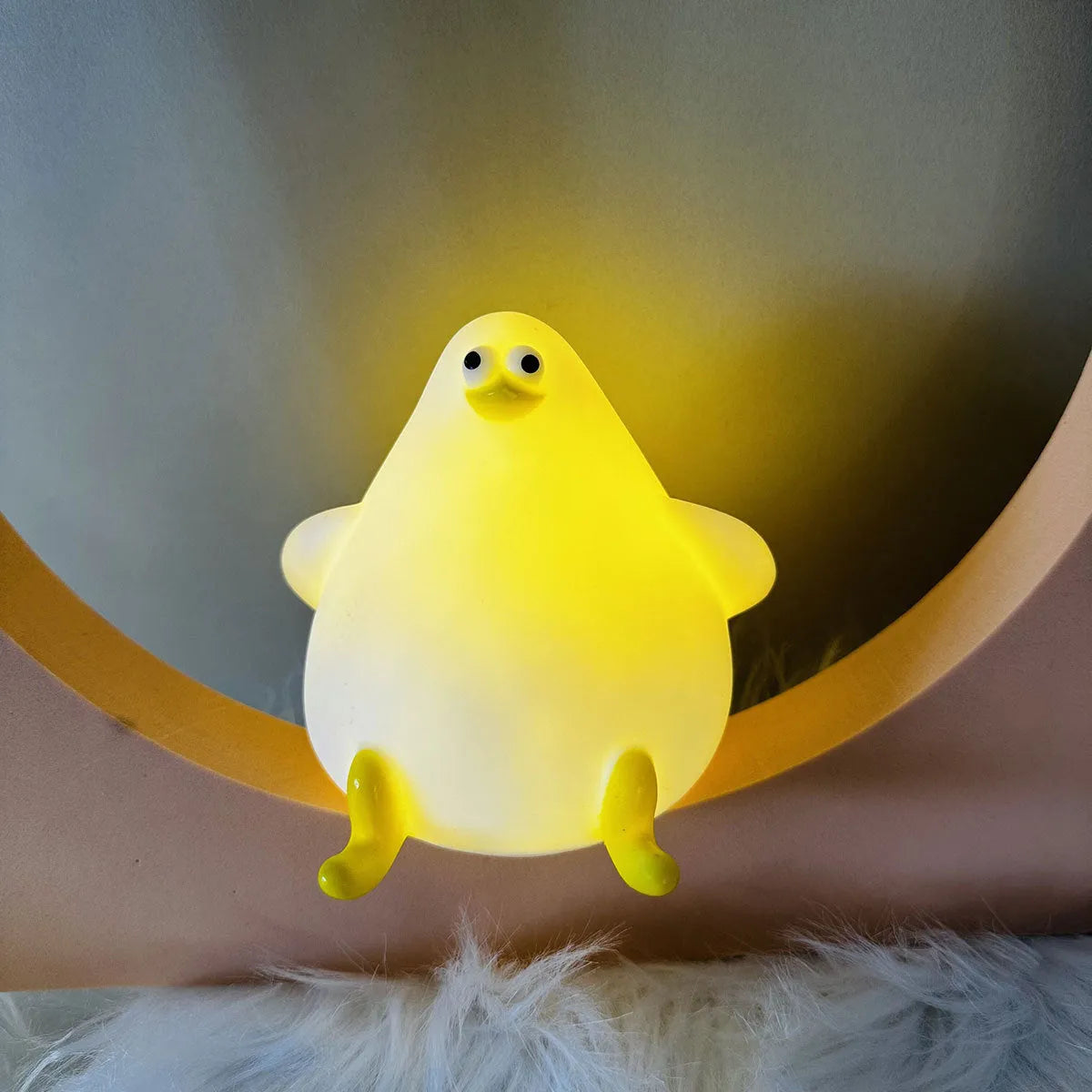 Cute cartoon silicone seagull night light USB rechargeable with soft glow on bedside table