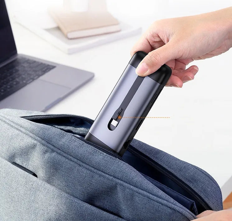 USB C docking station showing ports for HDMI, USB 3.0, PD charging, VGA, Ethernet, and card reader.