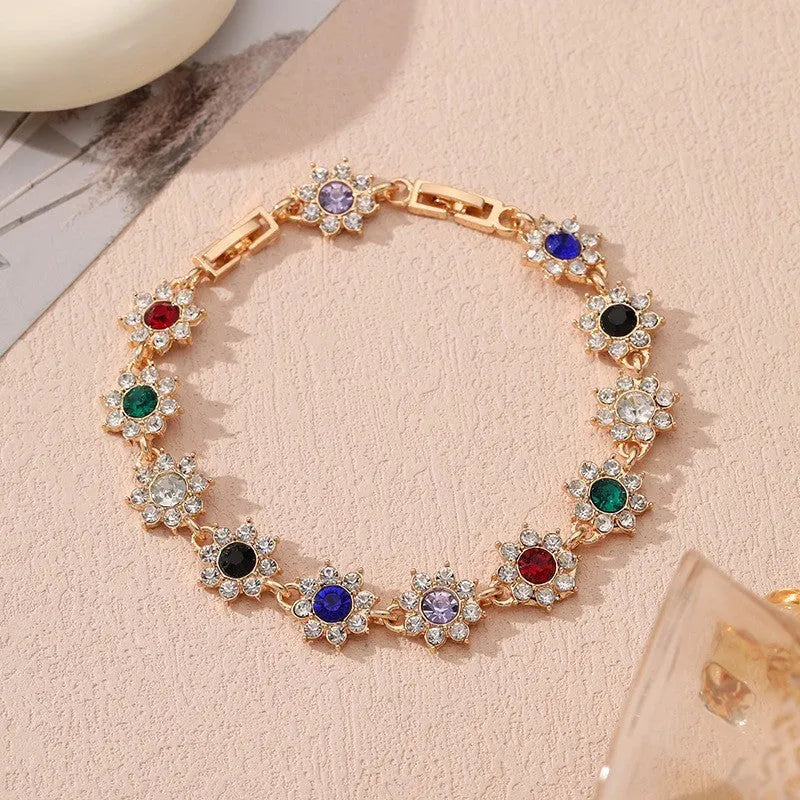 Close-up of a floral-shaped zinc alloy bracelet with an electroplated finish and crystal details.