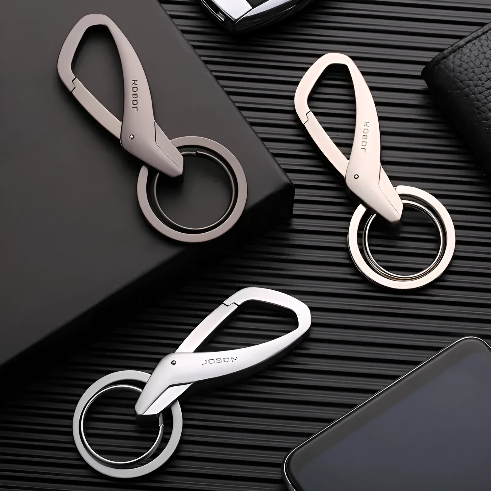 Black zinc alloy double ring waist keychain measuring 8.3 by 3.5 centimetres