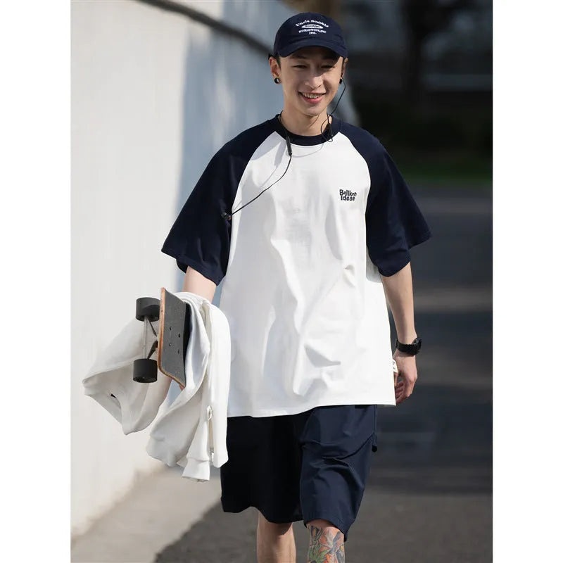 Men's blue Japanese raglan sleeve T-shirt with loose pullover fit on hanger