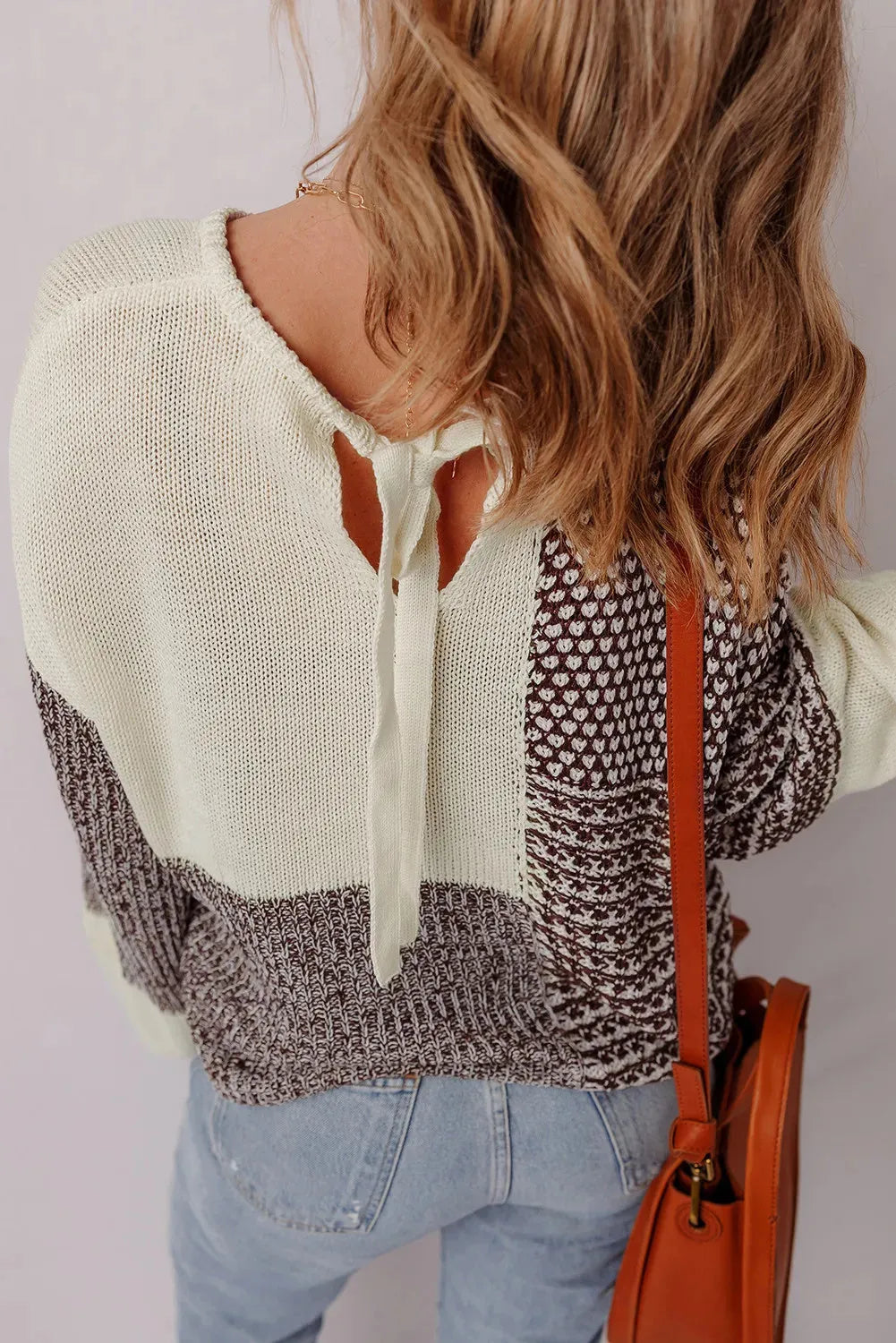 Dark khaki loose drop shoulder sweater with colour block panels and a back tie detail.