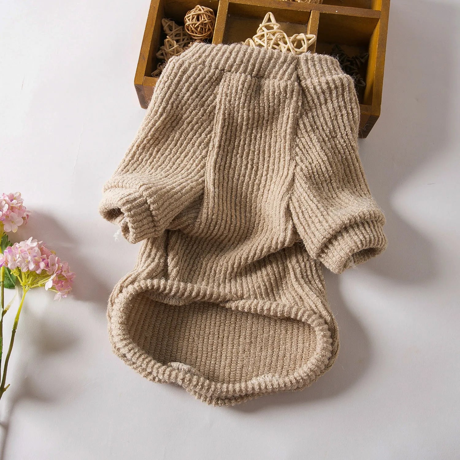 Brown cloth pullover sweater for small breed dogs on a Bichon Frise