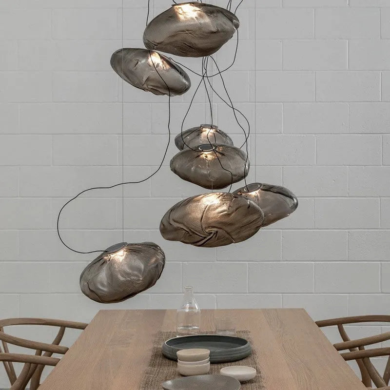 Modern glass decorative chandelier with LED lighting in leisure setting