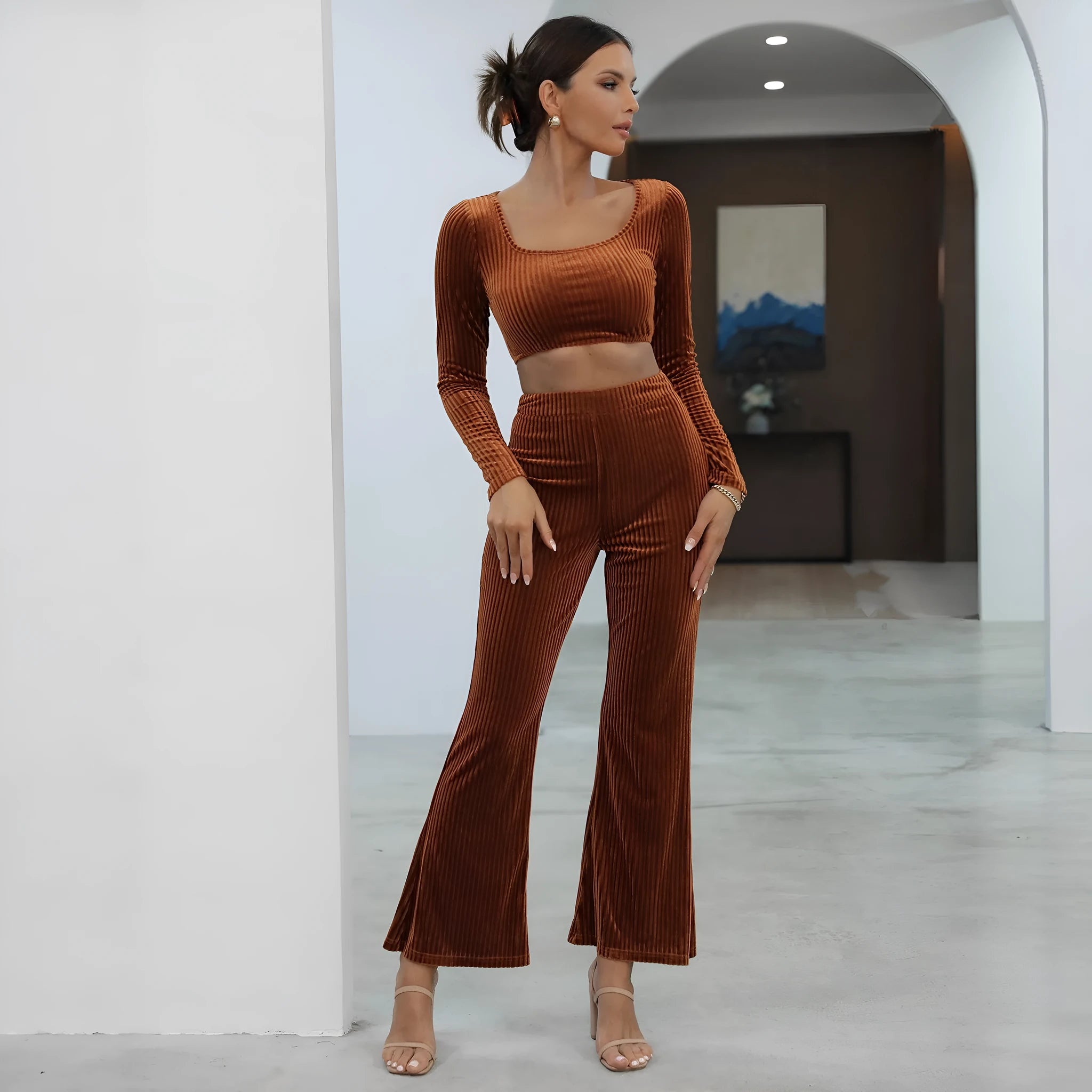 Caramel coloured long sleeve sweater and trouser casual set laid flat.