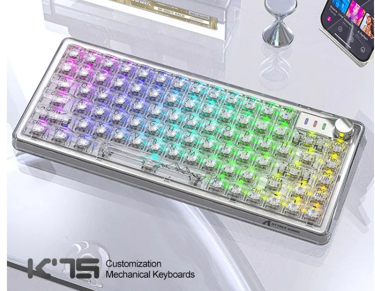 Attack Shark K75RGB wireless mechanical keyboard with transparent white case and RGB backlighting on a desk.