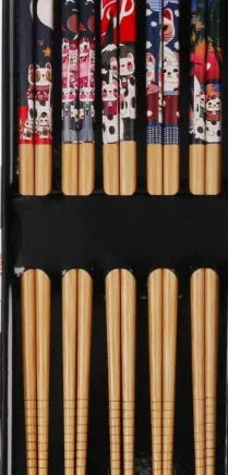 Set of bamboo chopsticks with Japanese lucky cat and elegant blue patterns in gift box or simple packaging.