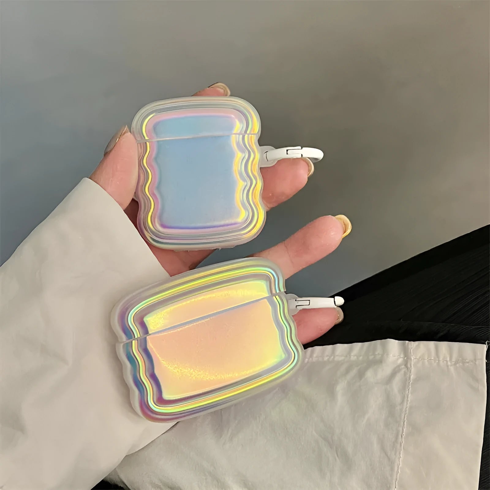 Silicone AirPods case with detailed magic laser and ring pattern design.