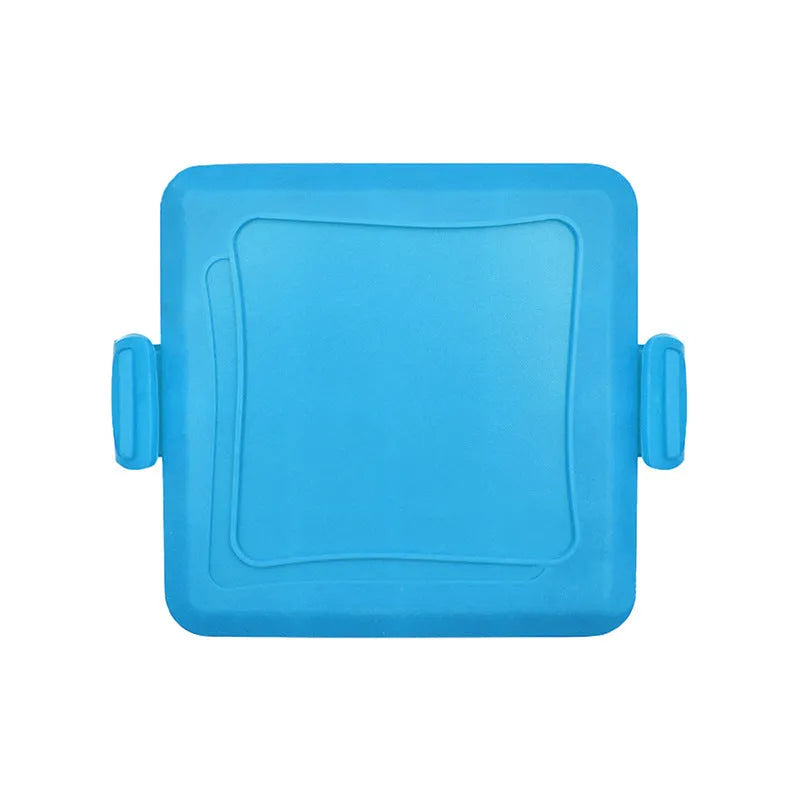 Red silicone baking tray with matching oven gloves on kitchen counter