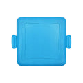 Red silicone baking tray with matching oven gloves on kitchen counter