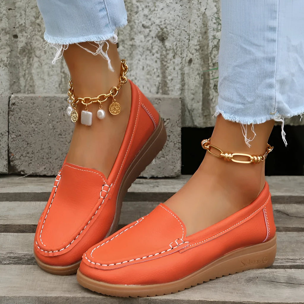 Women's flat slip-on loafers in soft PU leather shown in available colours with round toe and rubber sole