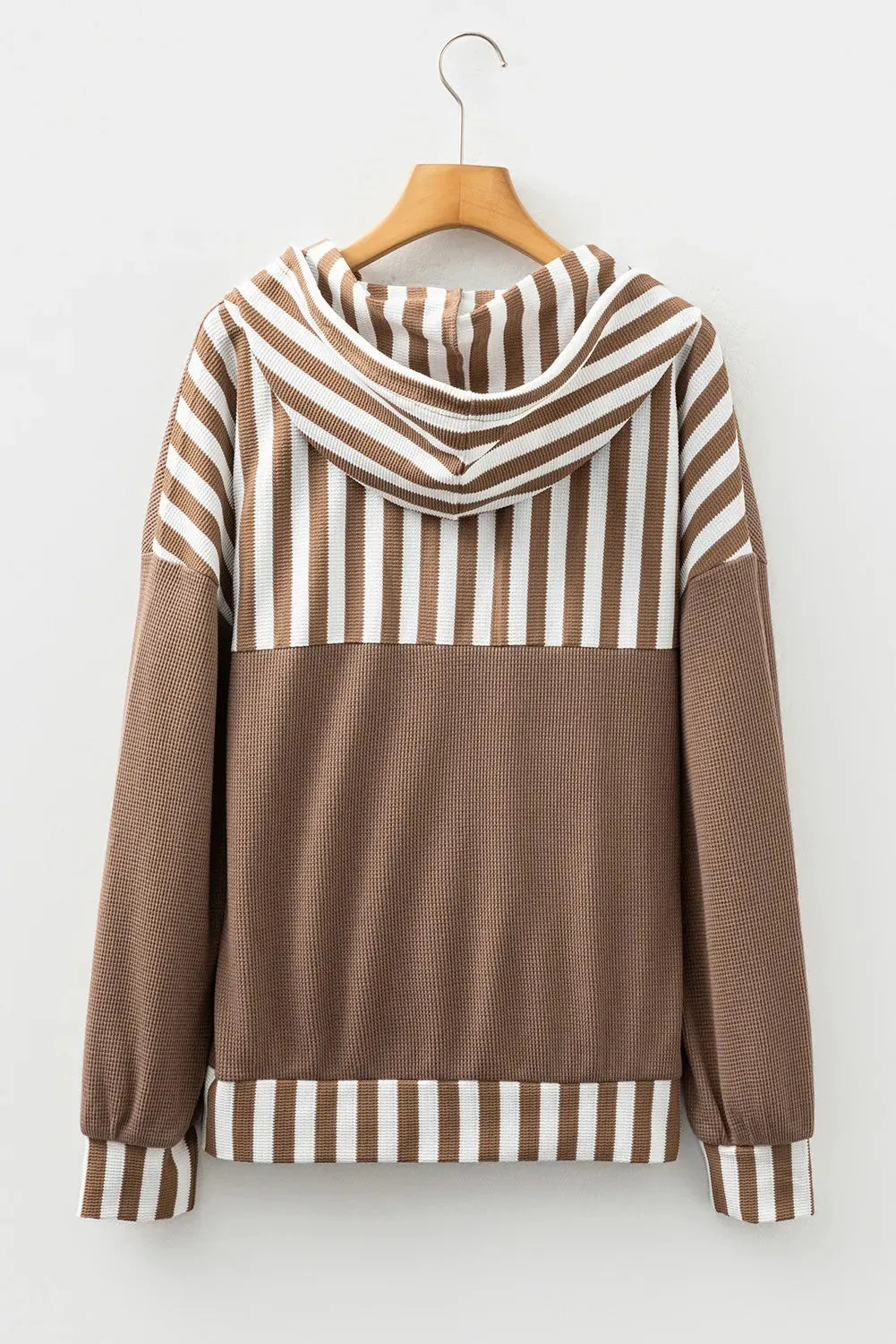 Straw yellow waffle texture hoodie with striped patchwork panels and a button neck.