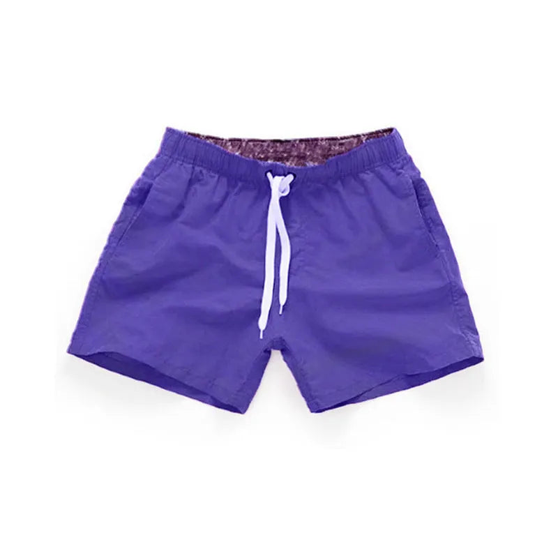 Men's plus-size polyester beach shorts in multiple colours on a size chart background.