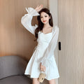 White long sleeve chiffon patchwork dress on a model, showing waist-slimming design and long skirt.