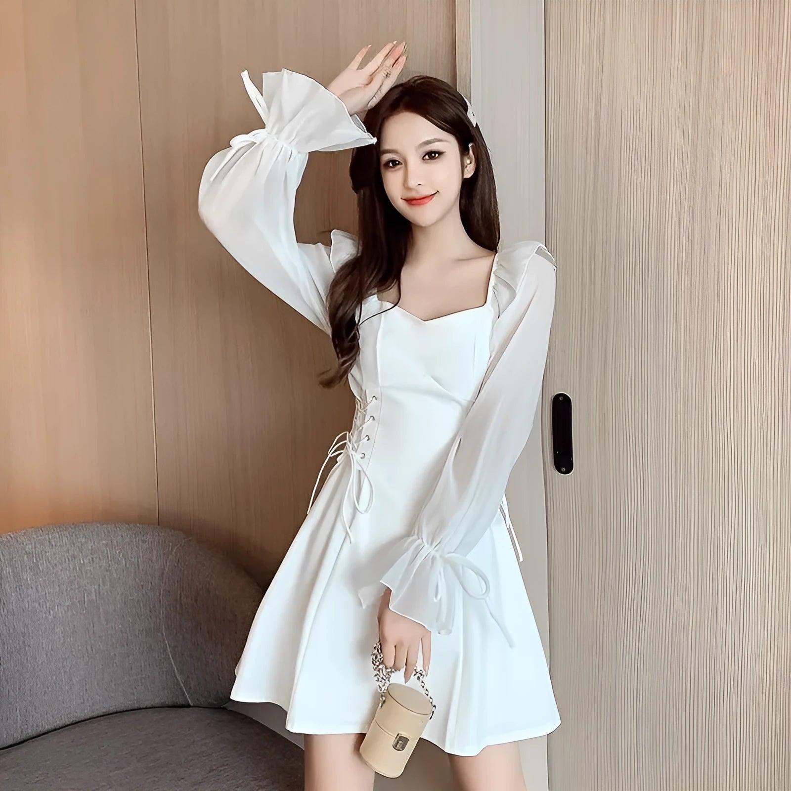 White long sleeve chiffon patchwork dress on a model, showing waist-slimming design and long skirt.