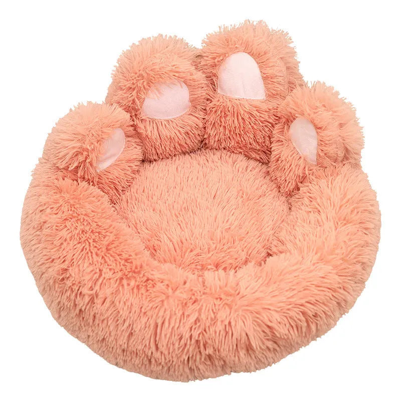 Round plush pet bed in coffee colour with raised rim and textured hand-shaped brush nest surface