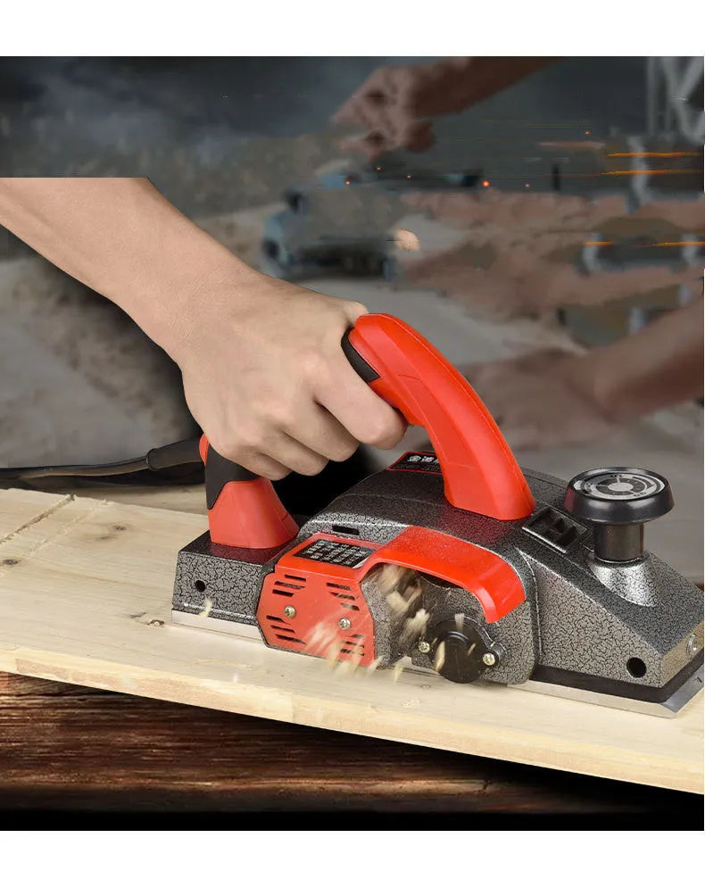 Red desktop electric wood planer with aluminium shell and 82mm planing width