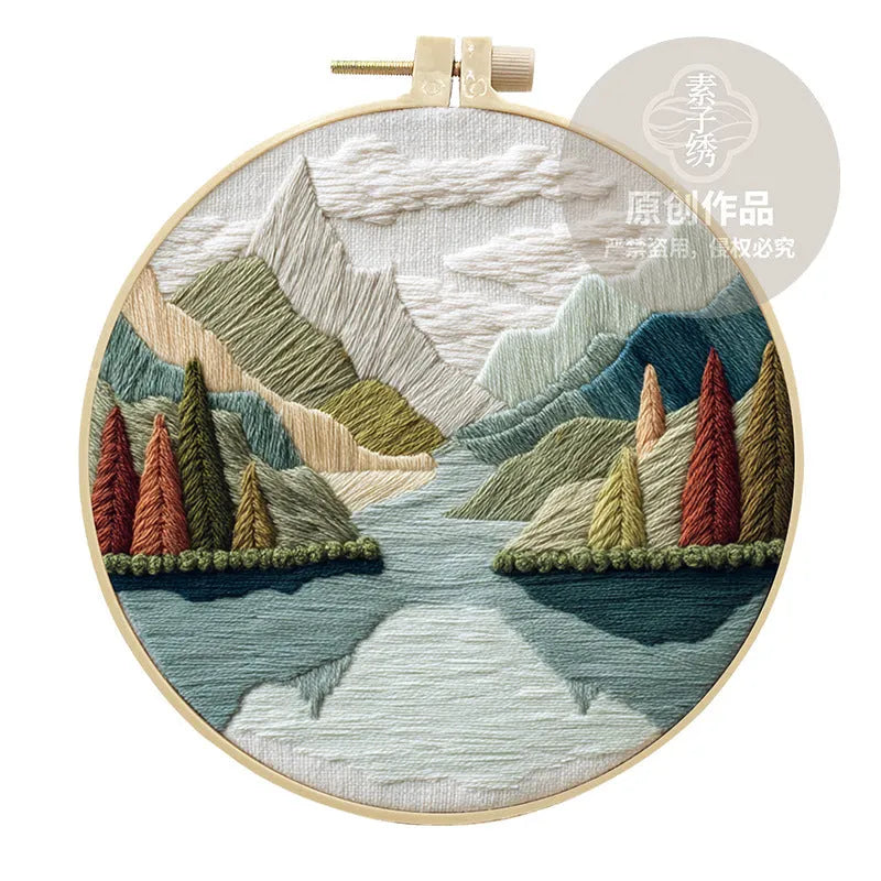 Embroidery DIY landscape kit with cotton fabric, bamboo frame, scissors, and thread for scenic designs