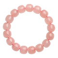 Pink crystal barrel bead bracelet with geometric design and 8 x 10mm beads