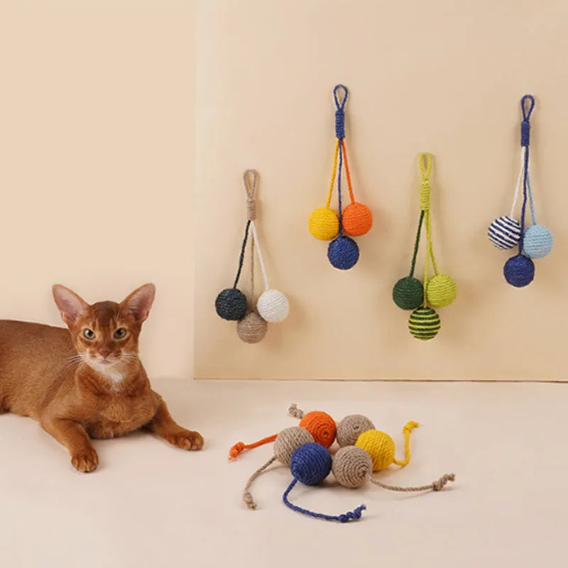 Blue and green cat toy set with a teaser stick and a catnip ball on a white background.
