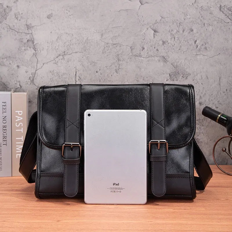 Black polyurethane commuter backpack with contrast stitching and anti-theft features
