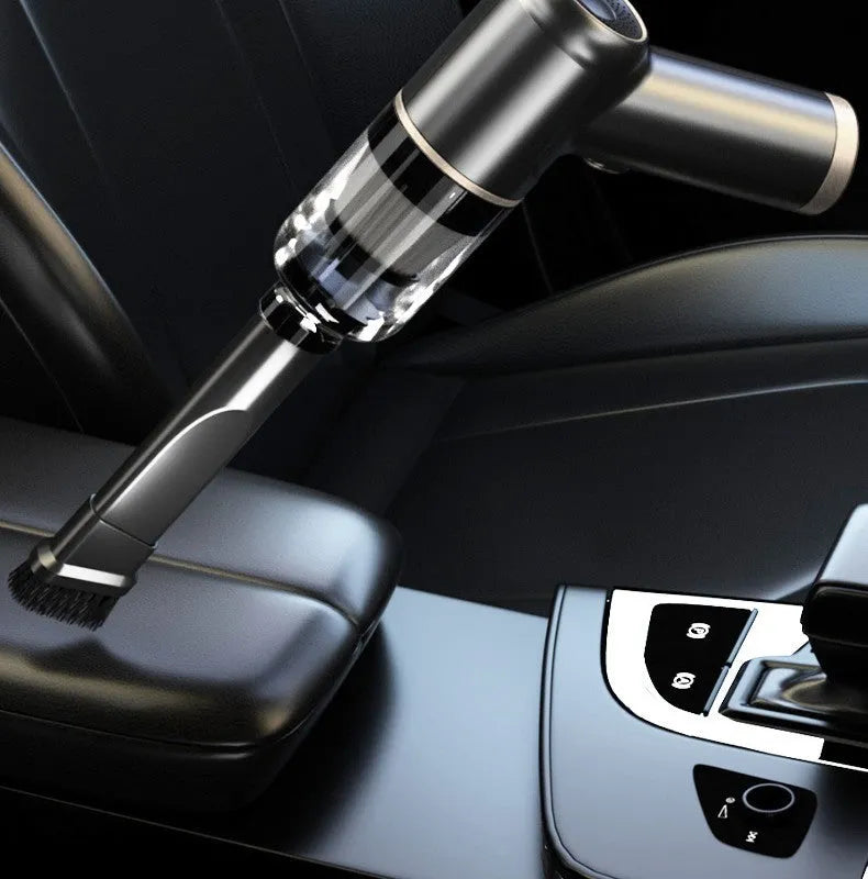 Black wireless car vacuum cleaner with multiple nozzle attachments including brush heads and suction tools