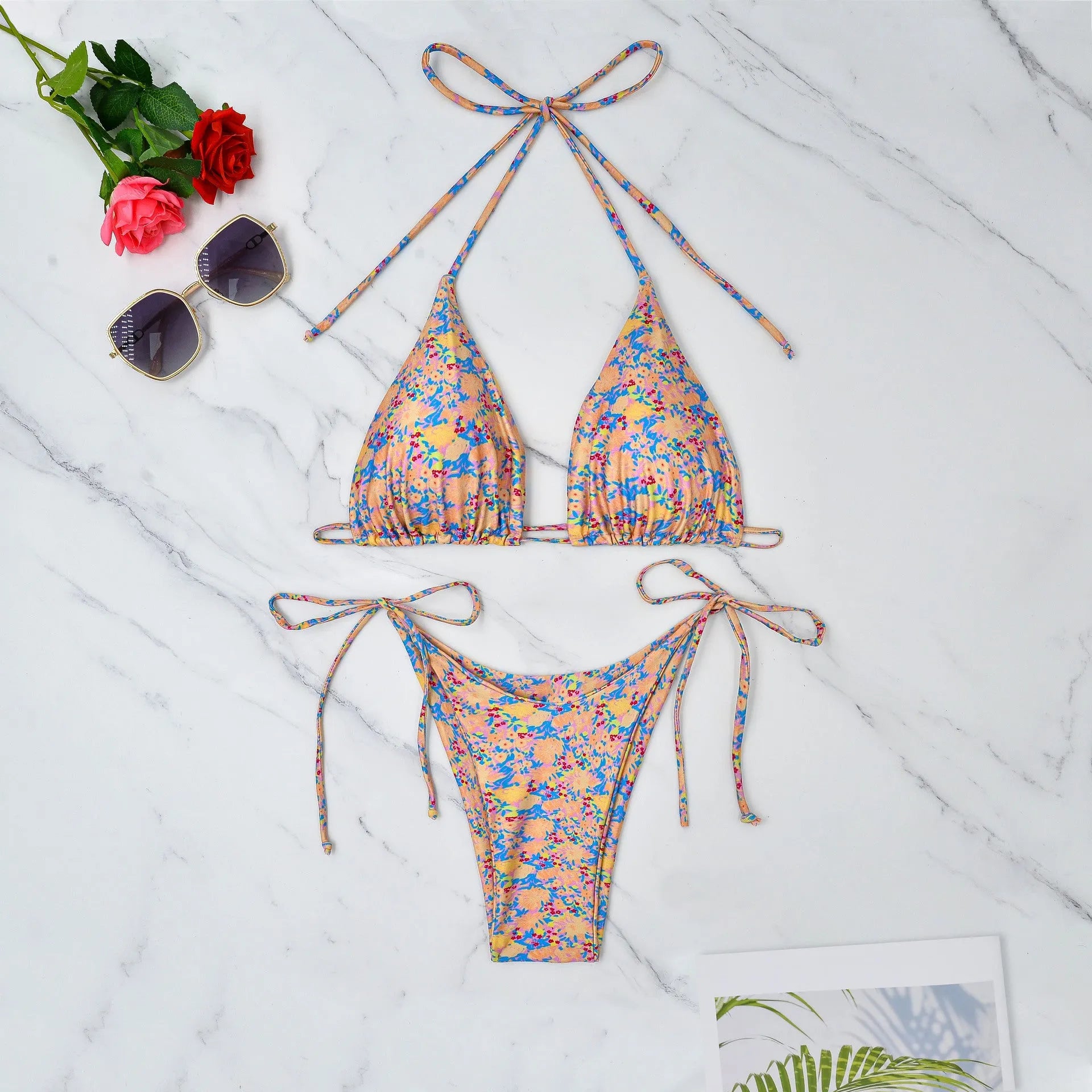 Women's lace-up bikini swimsuit in picture colour, showing backless design and high elasticity fabric.