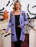Women's black Halloween cardigan with orange pumpkin head jacquard knit pattern, shown open.