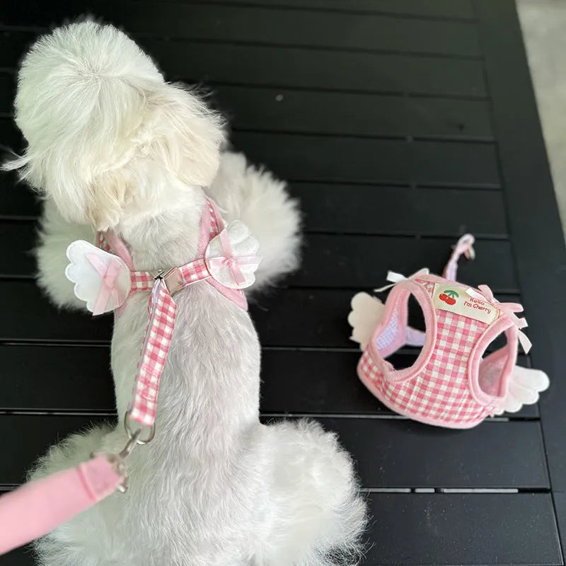 Pink and black cotton chest and back dog harness with hand holding rope in sizes XS to 2XL.