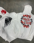 Black loose hooded sweatshirt with white printed skull pattern and rhinestone details on front