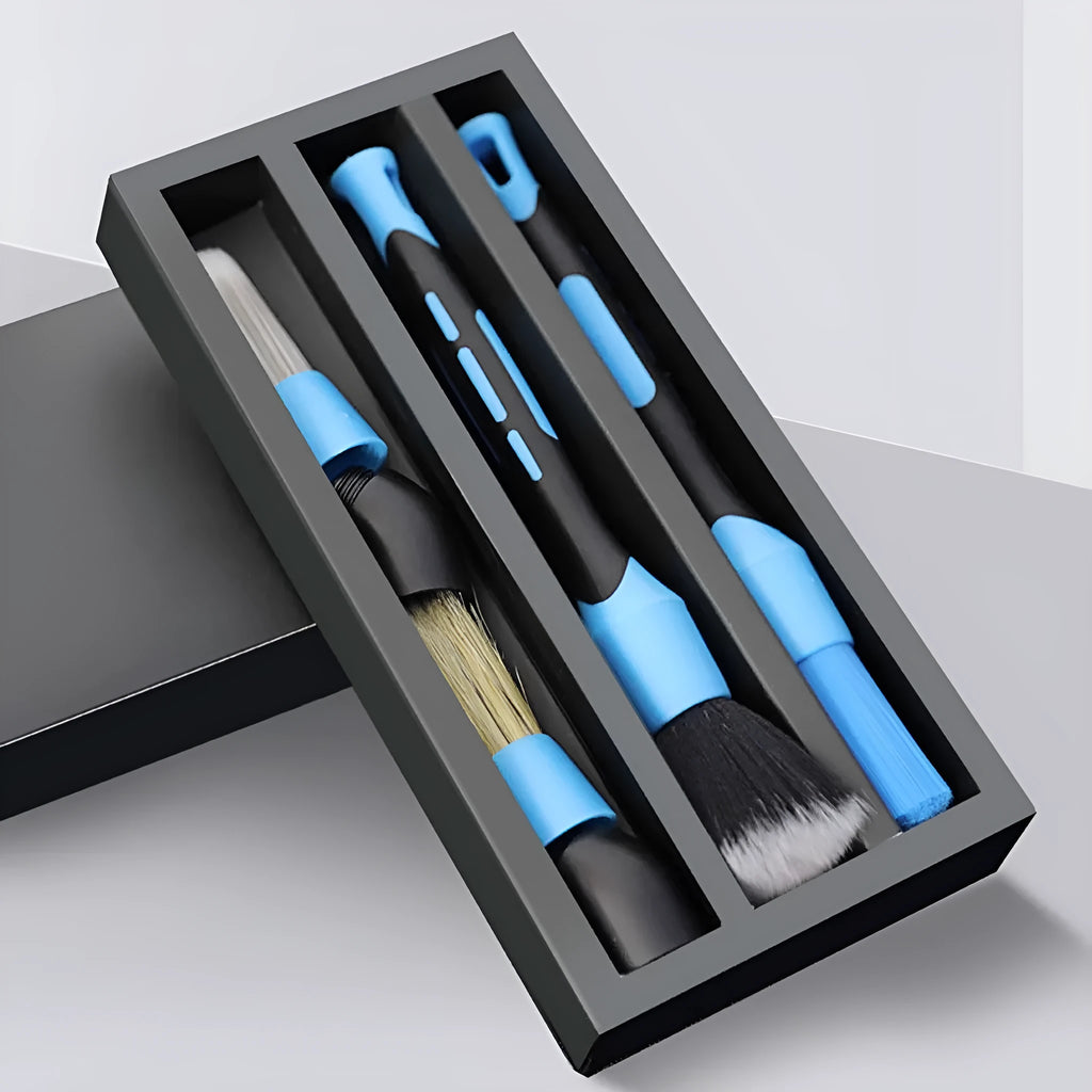 Blue detachable car wash brush set with 4 brush heads, 2 handles, and 2 elbow connectors on a workspace