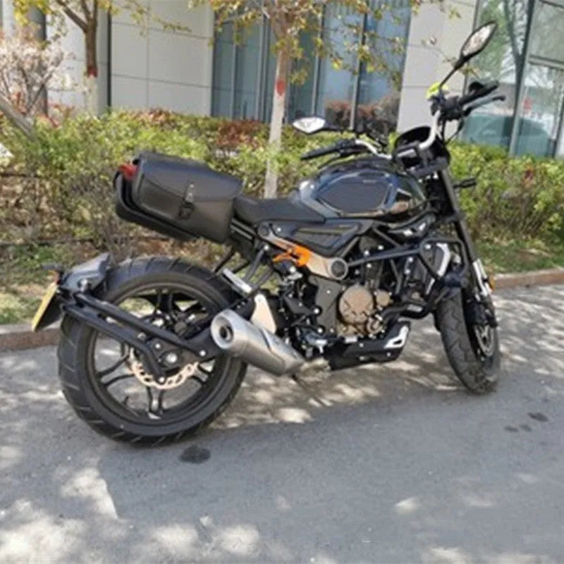 Black PU leather motorcycle swingarm saddlebag mounted on a Harley Sportster side.