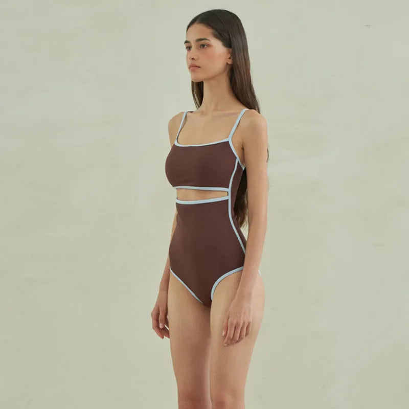 Brown women's triangle one-piece swimsuit made from nylon fabric.