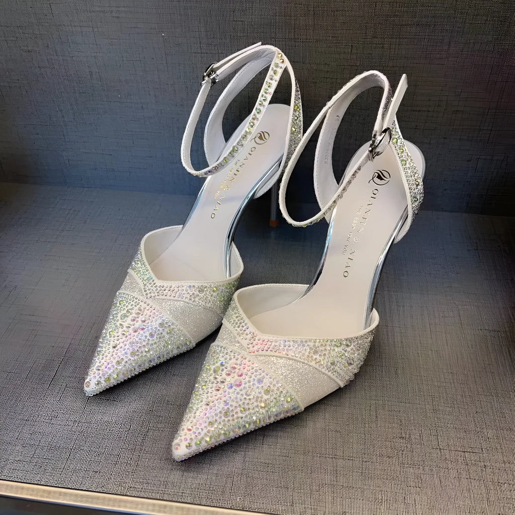 Women's silver and black hollow high heels with red sole and pointed stiletto heel