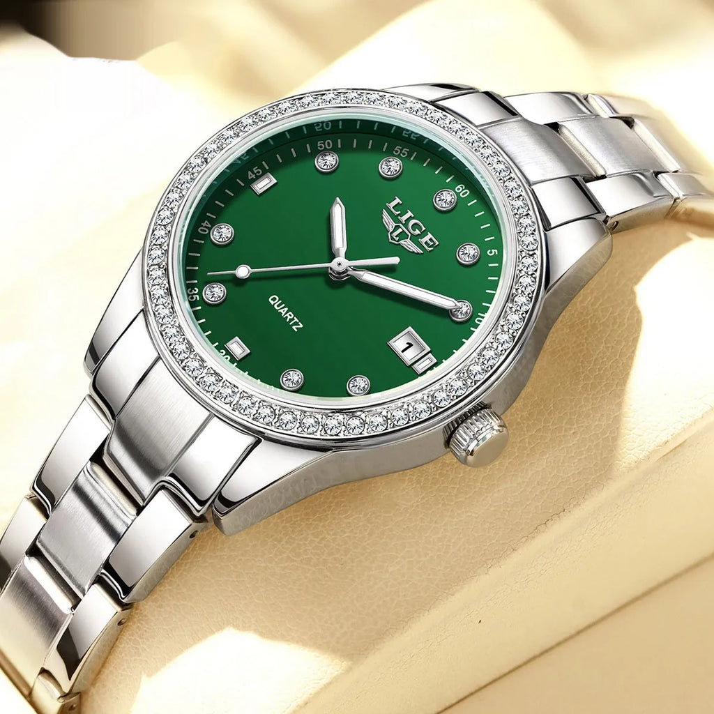 Silver quartz watch with diamond encrusted dial and luminous hands on stainless steel strap