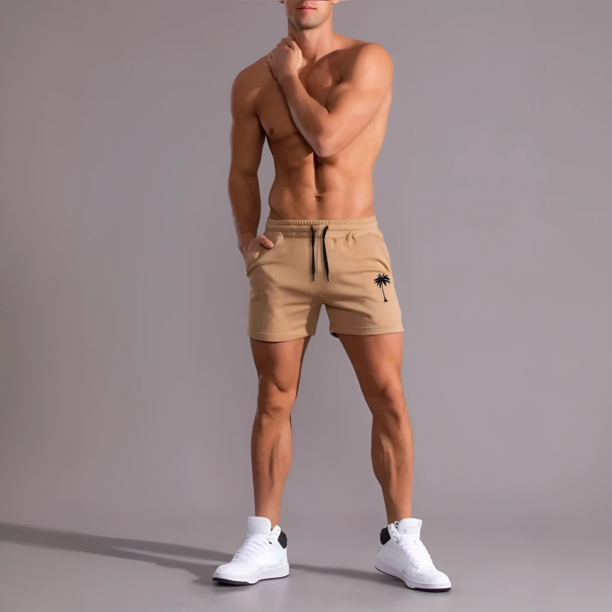 Men's khaki sports shorts with coconut palm leaf print, elastic waistband, straight cut design